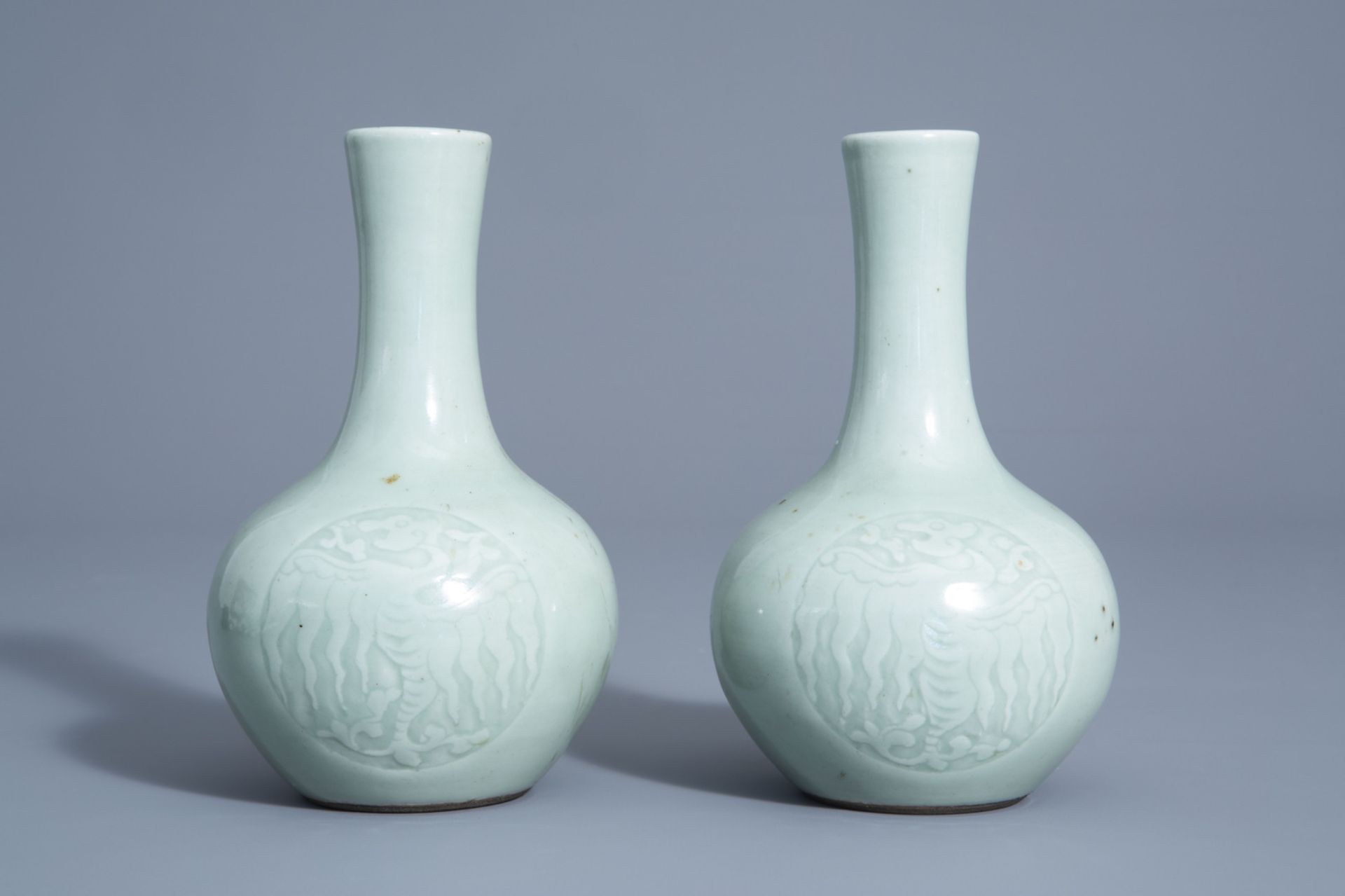 A pair of Chinese monochrome celadon bottle vases with incised phoenix medallions, Yongzheng mark, 1 - Image 2 of 7