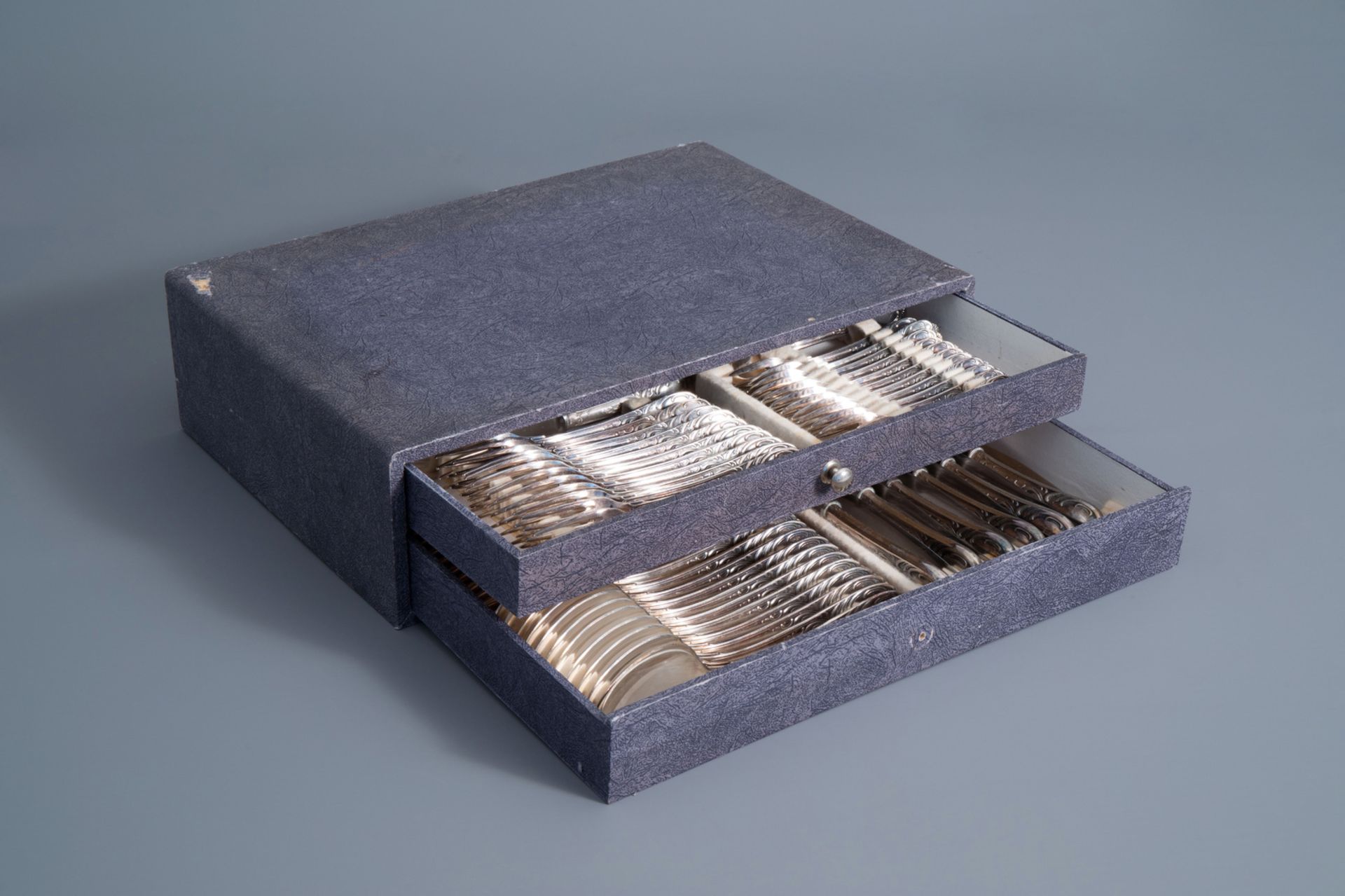 An 84-piece silver plated Louis XV style cutlery set with matching box, Solingen, Germany, 20th C.