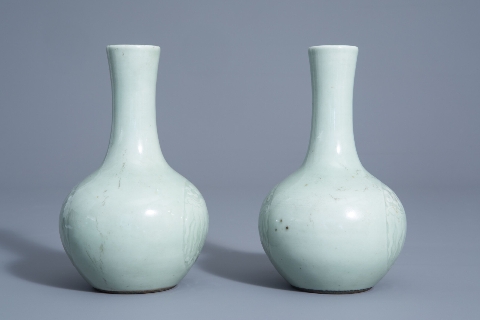 A pair of Chinese monochrome celadon bottle vases with incised phoenix medallions, Yongzheng mark, 1 - Image 5 of 7
