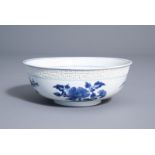 A Chinese blue and white relief moulded 'Immortals' bowl, Kangxi