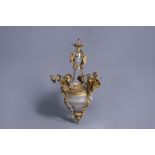 A gilt bronze chandelier with putti and floral design, 19th/20th C.