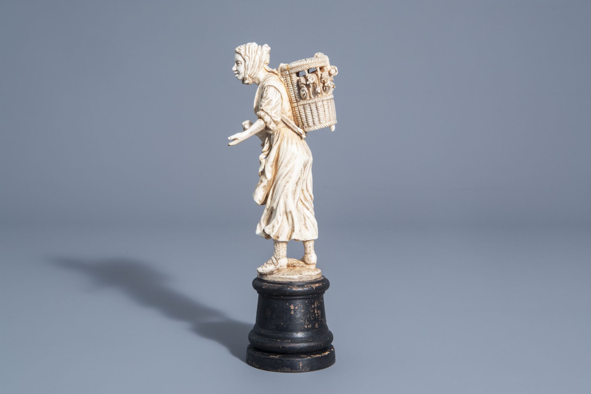 A carved ivory figure of a lady with poultry on wooden base, probably Dieppe, France, 19th C. - Image 5 of 7