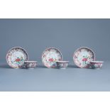 Three Chinese famille rose cups and saucers with floral design, Yongzheng