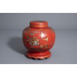 A Chinese painted and red lacquered jar and cover on stand, 19th/20th C.