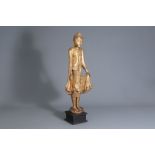 A Thai gilt lacquered standing Buddha figure, 19th/20th C.