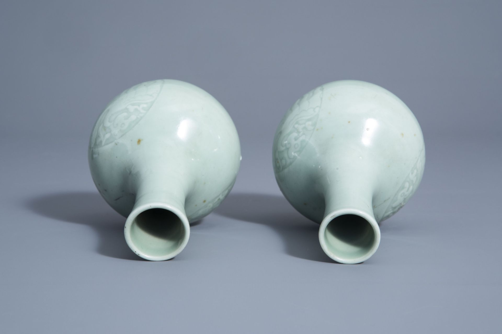 A pair of Chinese monochrome celadon bottle vases with incised phoenix medallions, Yongzheng mark, 1 - Image 6 of 7