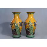 A pair of massive Chinese sancai relief moulded vases, 20th C.