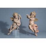 A pair of carved and polychrome painted wooden music-making angels, Germany, 19th C.
