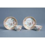 A pair of Chinese famille rose 'hunting scene' cups and saucers, Qianlong