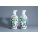 A pair of Chinese famille rose vases with figures and water buffaloes in a landscape, 19th/20th C.