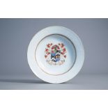 A Chinese export porcelain armorial plate with bianco sopra bianco design, Qianlong