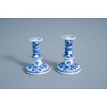 A pair of Chinese blue and white candlesticks with floral design, Kangxi