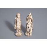 A pair of Japanese ivory and bone okimono of an European couple, Meiji, 19th/20th C.