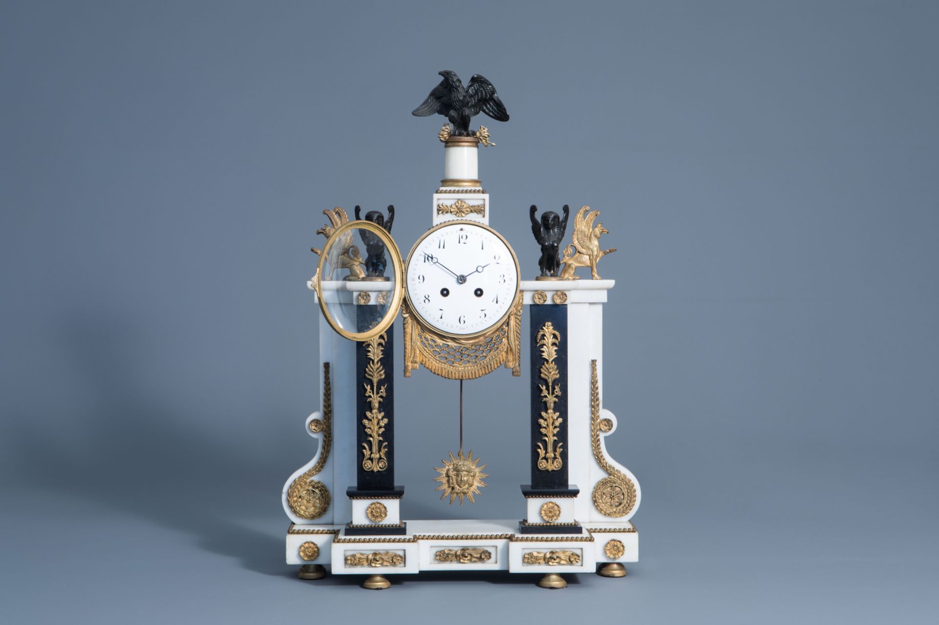 A French white and black marble gilt bronze mounted 'Return of Egypt' style portico clock, 19th C. - Image 2 of 14