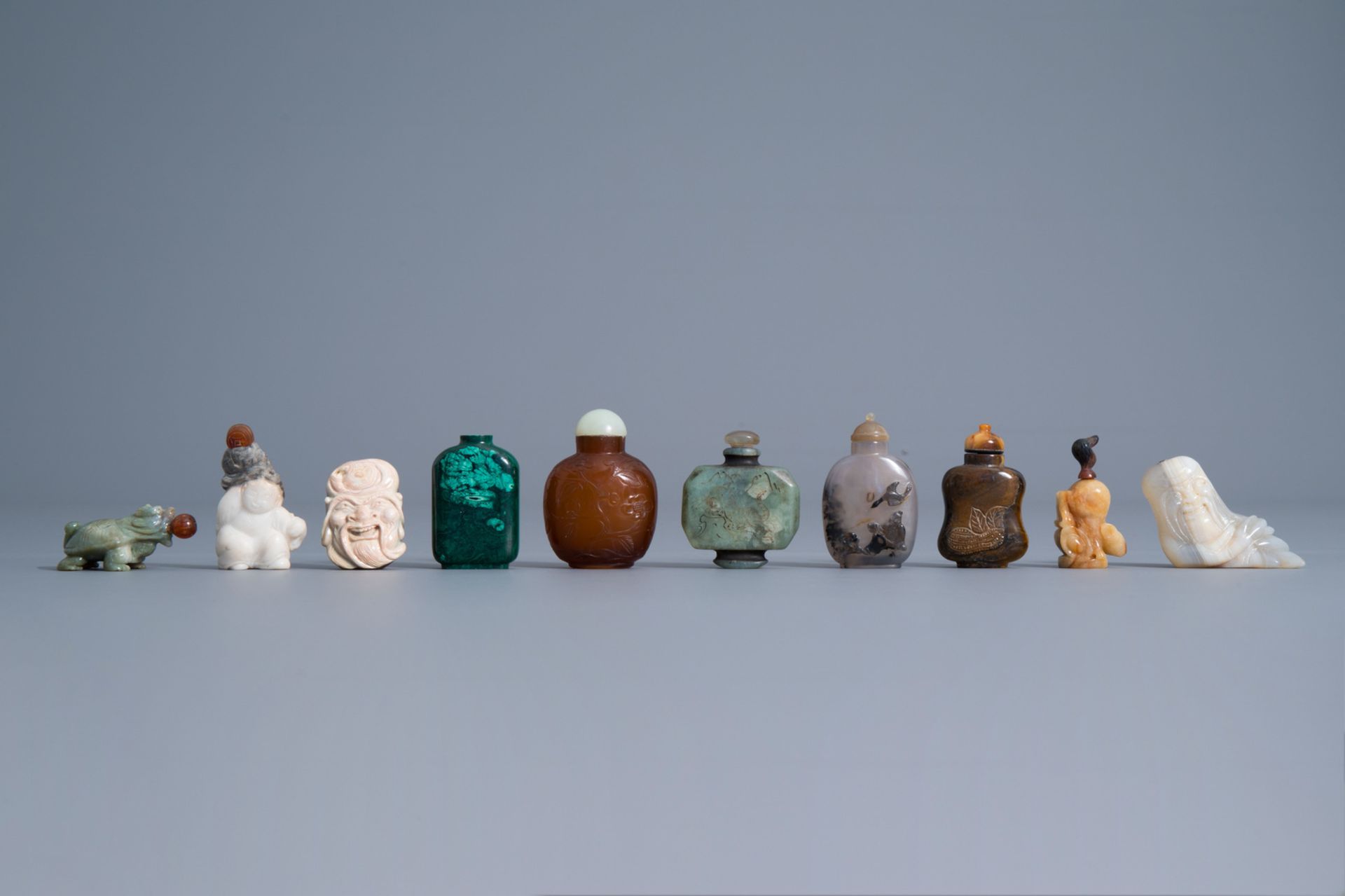 Ten various Chinese carved stone snuff bottles, 19th/20th C.