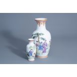 Two Chinese famille rose vases with figures in a garden, 20th C.