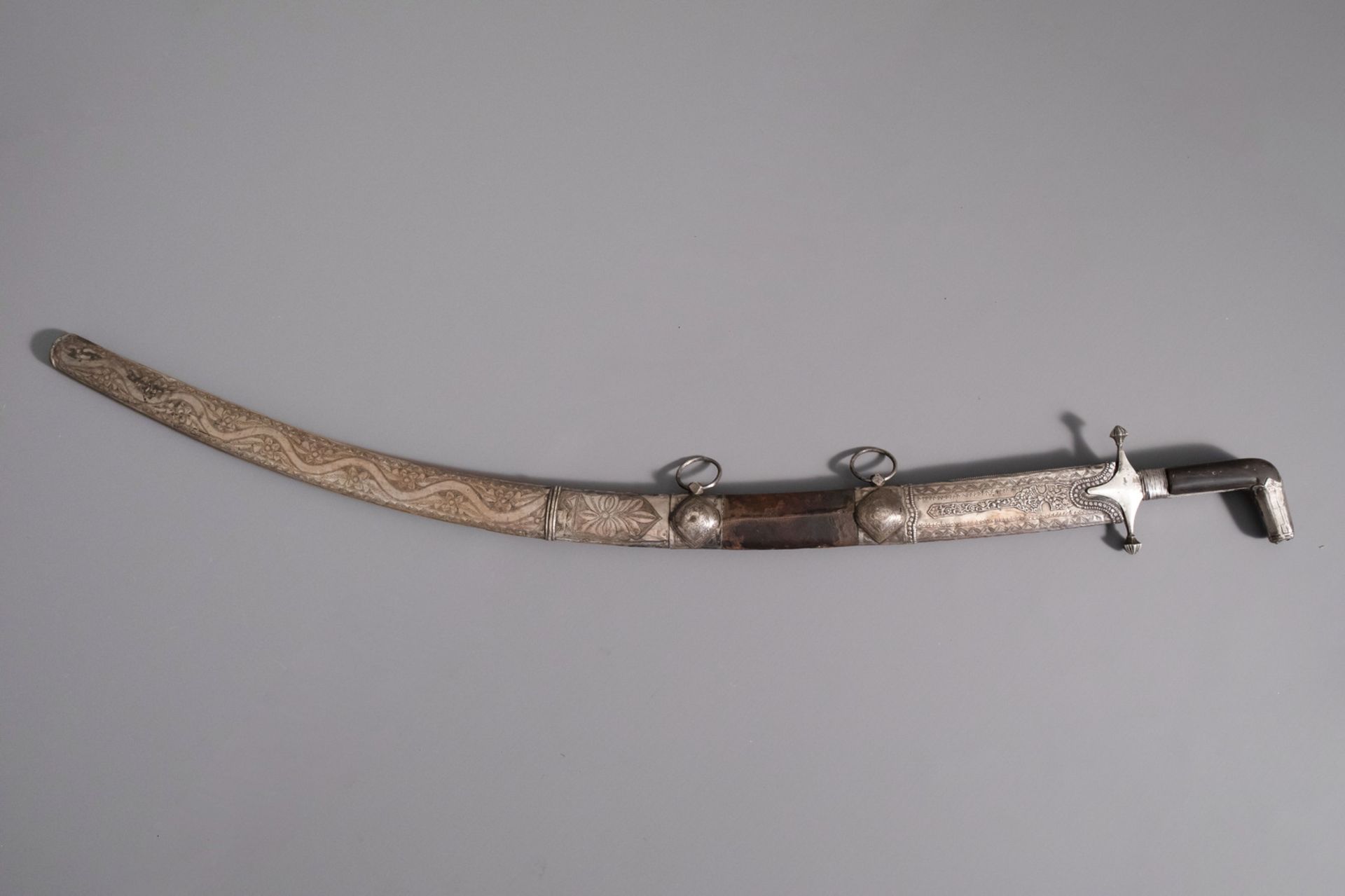 An Islamic 'Shamshir' sword with leather and silver scabbard, Middle East, 19th/20th C.