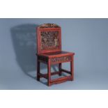 A Chinese lacquered and gilt wooden chair, 19th/20th C.