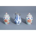 A Chinese blue and white silver mounted jug and a pair of wucai vases and covers, Kangxi or later