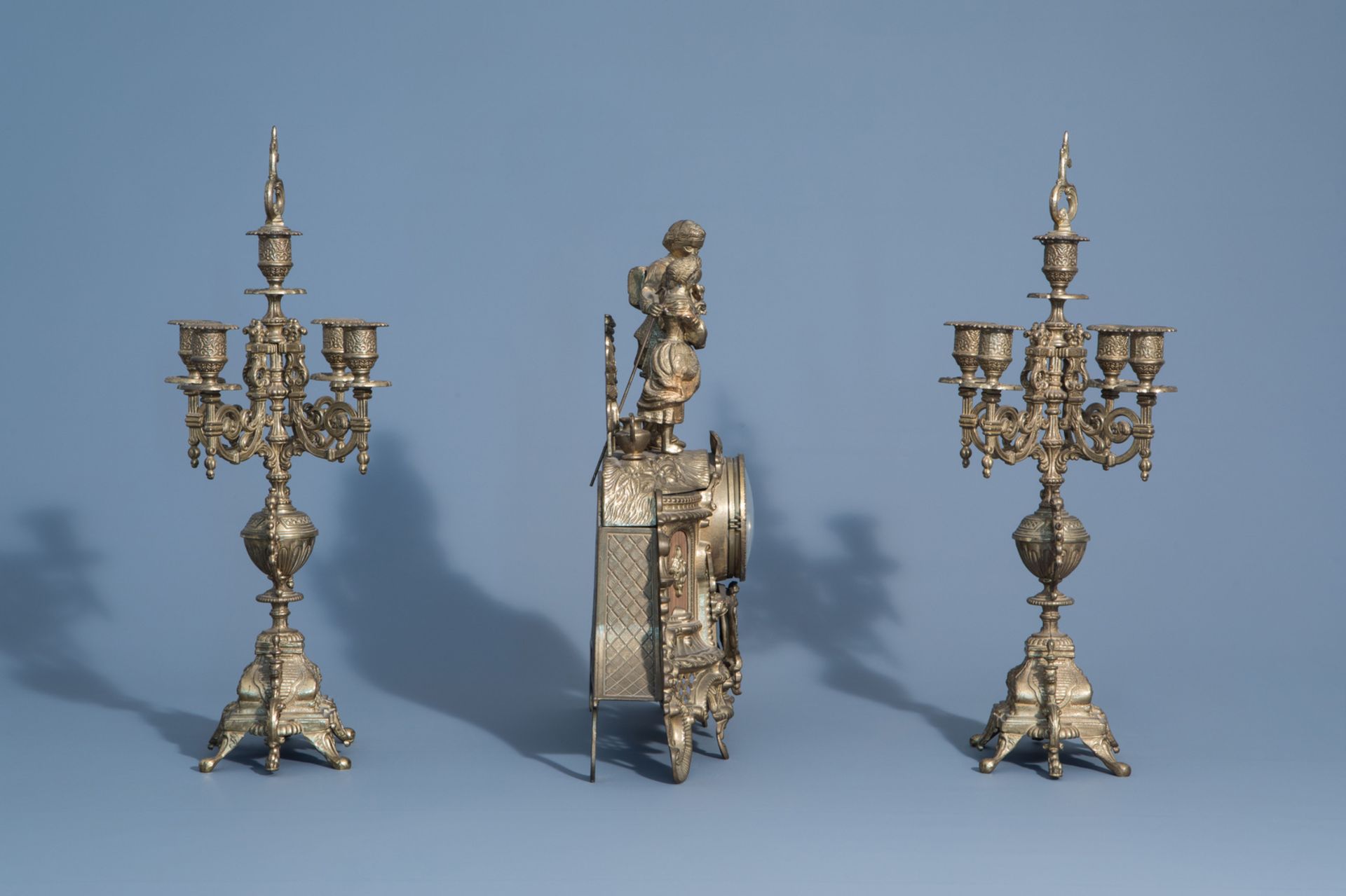 A French three-piece gilt metal romantic clock garniture, 19th/20th C. - Image 3 of 8