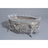 An imposing silver centerpiece with love theme and floral design with accompanying bowl, France, 19t