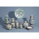 A varied collection of Chinese Nanking crackle glazed famille rose vases, ginger jars, a charger and