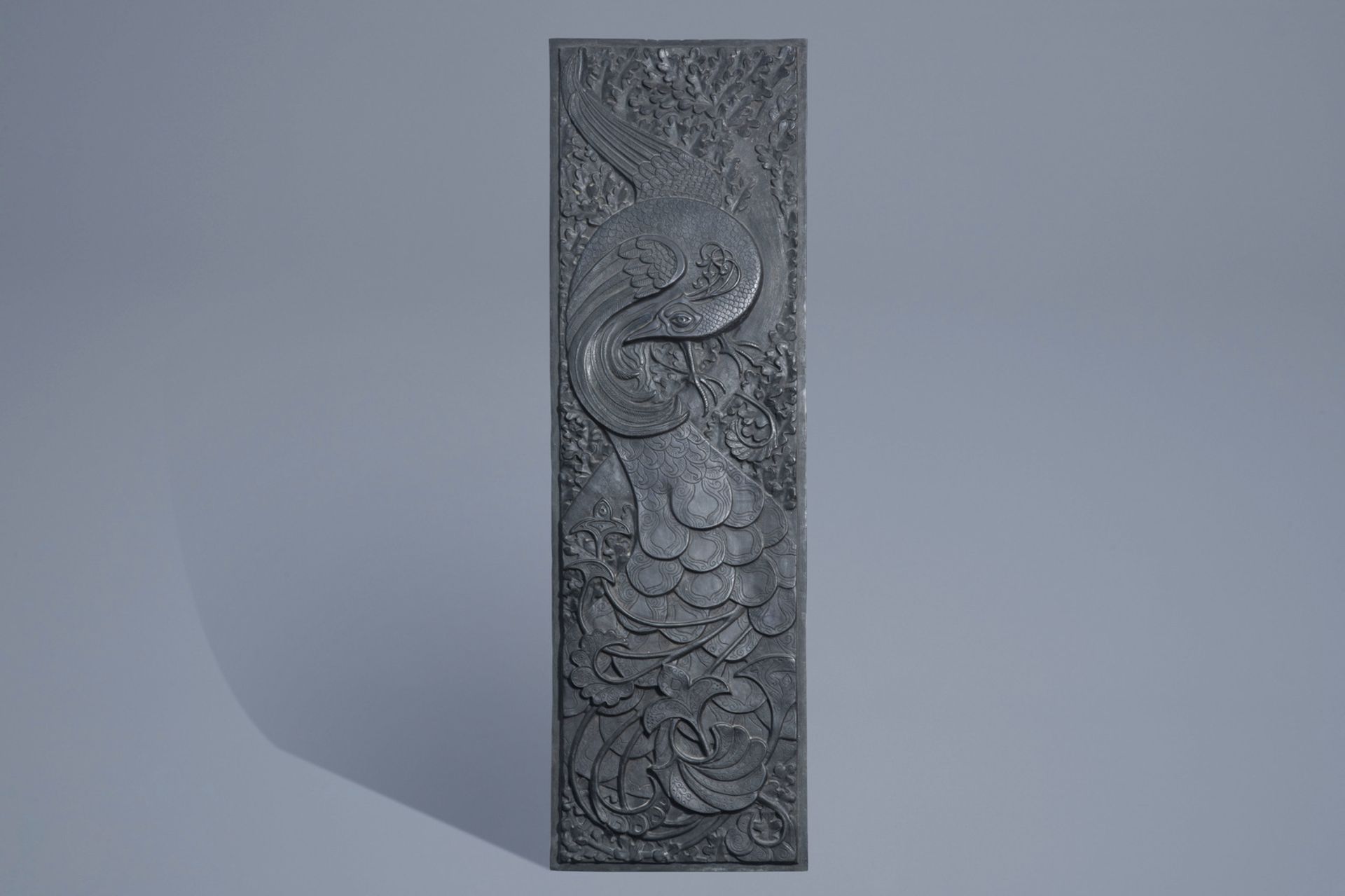 A large Japanese Art Deco patinated bronze 'phoenix' plaque, Meiji/Showa