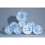Seven Chinese blue and white dishes and a charger with different designs, Kangxi/Qianlong