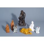 Seven Chinese figures in wood, porcelain and Shiwan pottery, 19th/20th C.