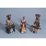 Three Chinese Shiwan pottery models of relaxing ladies, seal marks, 20th C.