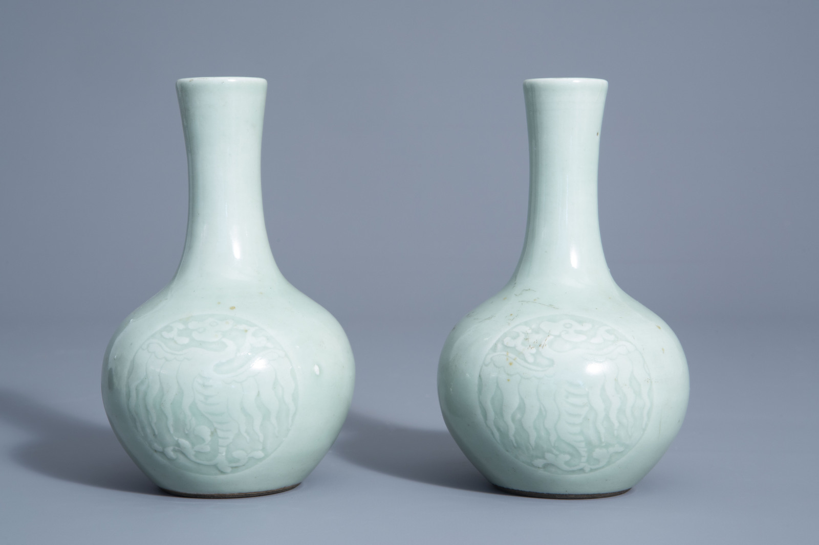 A pair of Chinese monochrome celadon bottle vases with incised phoenix medallions, Yongzheng mark, 1 - Image 4 of 7