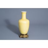 A Chinese bronze mounted monochrome yellow vase, 19th/20th C.