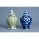 A Chinese blue and white jar and cover with prunus on cracked ice and a famille verte jar and cover