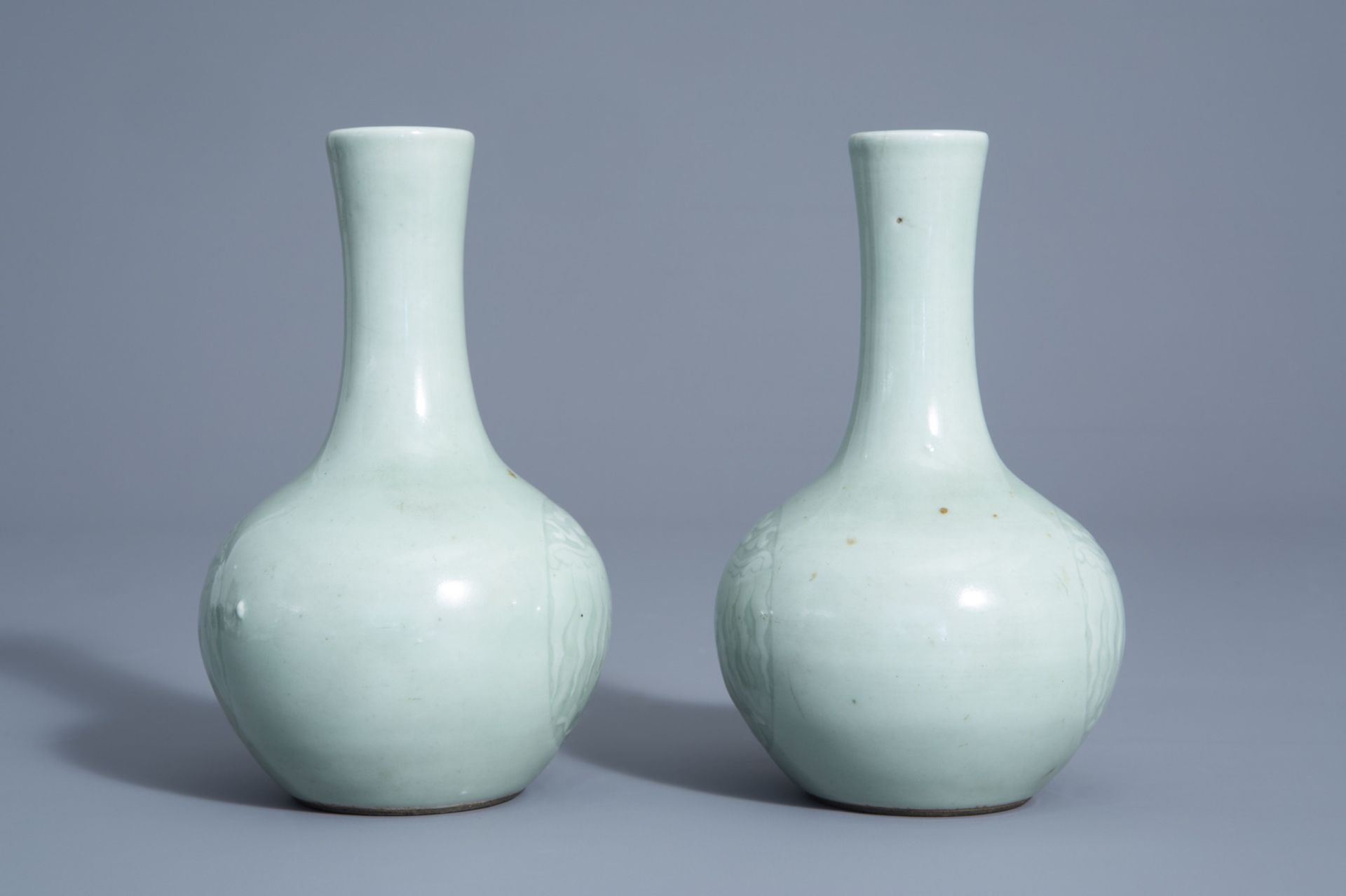 A pair of Chinese monochrome celadon bottle vases with incised phoenix medallions, Yongzheng mark, 1 - Image 3 of 7