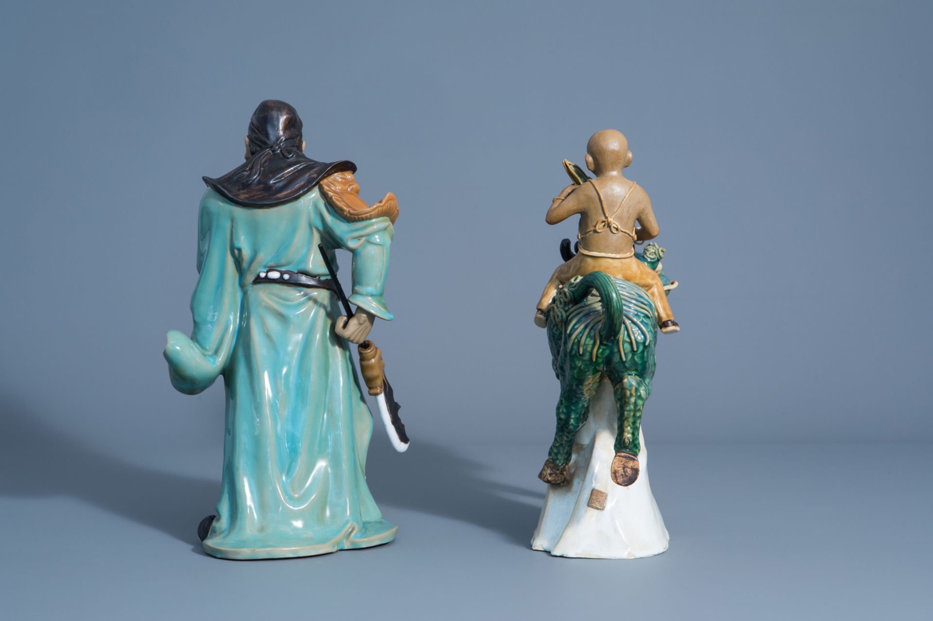 Two Chinese Shiwan pottery models of a warrior and a boy riding a Buddhist lion, 20th C. - Image 4 of 8