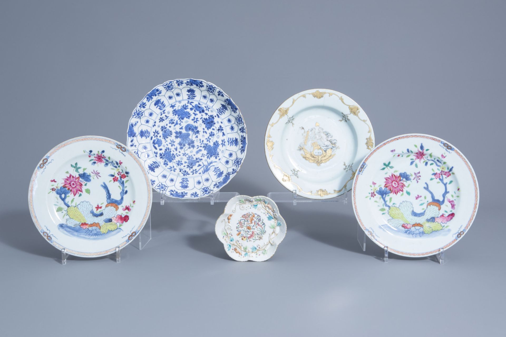 Five Chinese blue, white, famille rose, grisaille and gilt plates and saucers, 18th C.