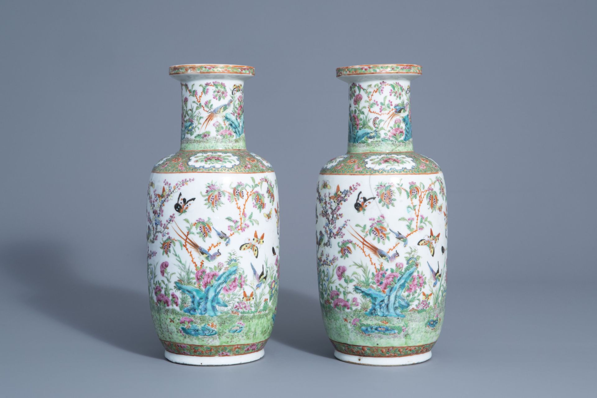 A pair of Chinese Canton famille rose vases with birds and butterflies among blossoms, 19thC. - Image 3 of 6