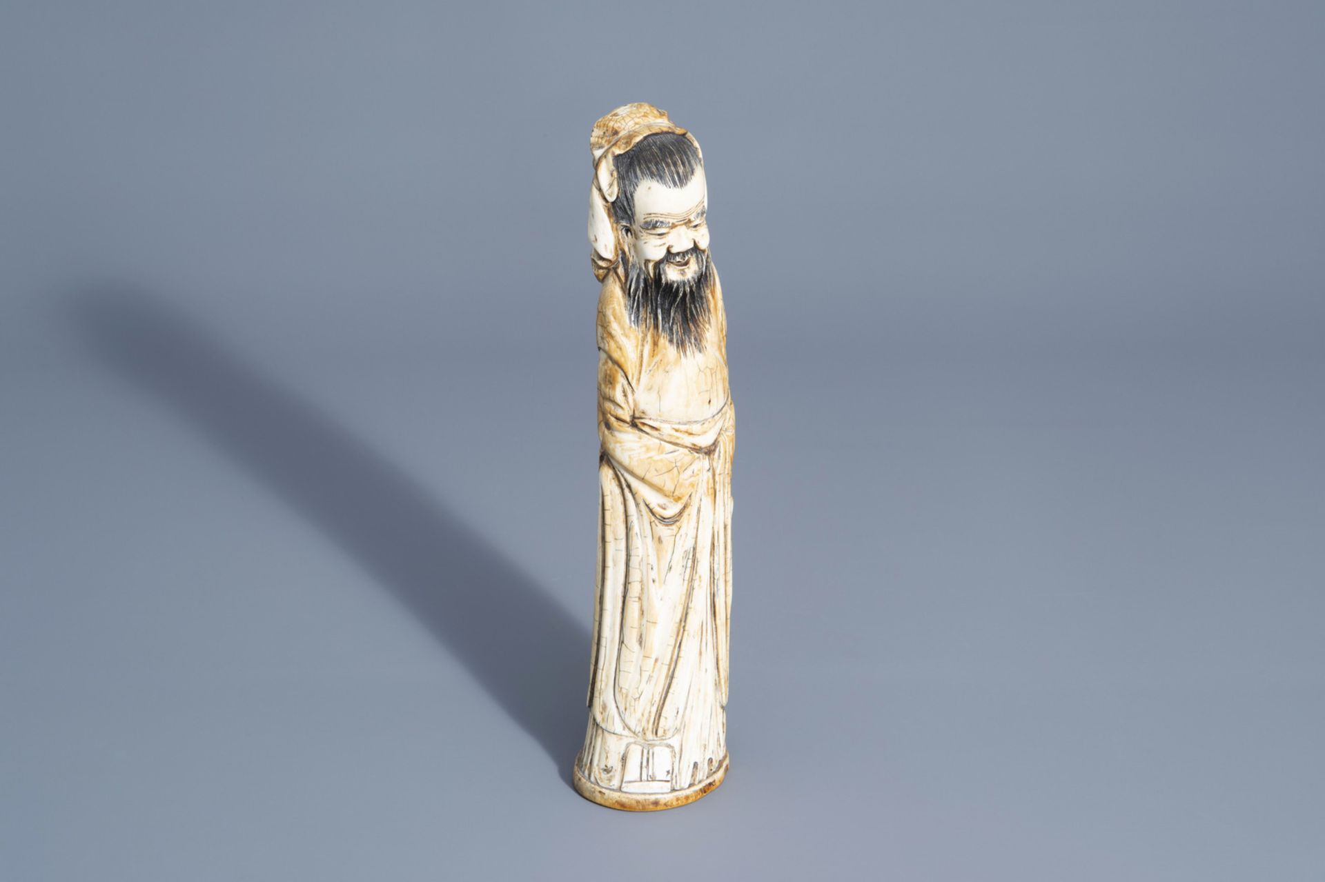 A Chinese carved figure of an Immortal, about 1900