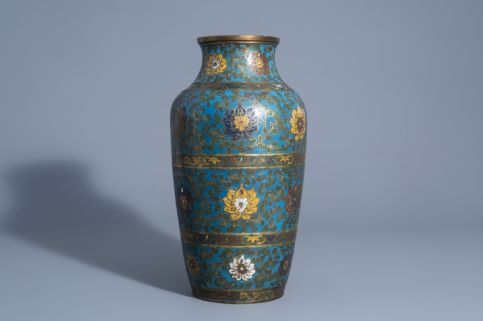 A Chinese or Japanese cloisonnŽ vase with lotus scrolls, 18th/19th C.