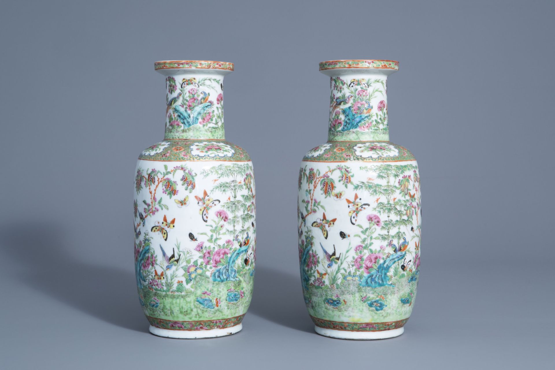 A pair of Chinese Canton famille rose vases with birds and butterflies among blossoms, 19thC. - Image 4 of 6