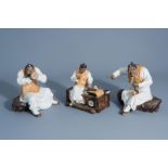 Three Chinese Shiwan pottery figures of musicians, seal marks, 20th C.