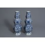 A pair of Chinese blue and white hexagonal triple gourd vases with floral design, 19th C.