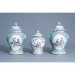 Three Chinese famille rose turquoise ground vases and covers, Qianlong mark, 20th C.