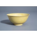 A Chinese yellow ground bowl with incised underglaze design, Yongzheng mark, 19th/20th C.