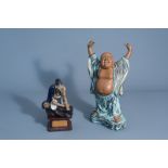 A Chinese Shiwan pottery figure of Buddha and one of a monk on a base, seal mark, 20th C.