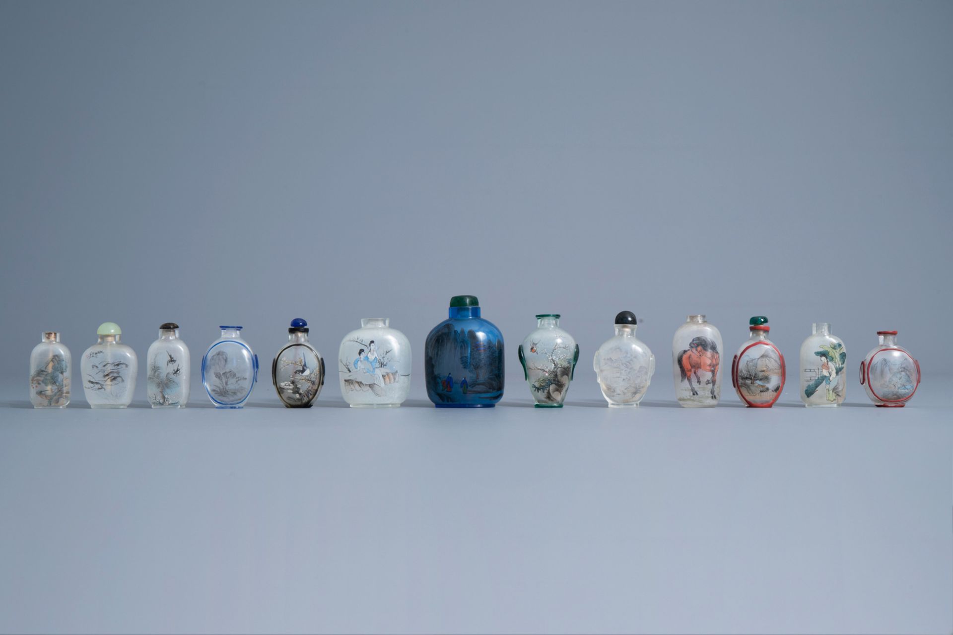 Thirteen Chinese inside-painted glass snuff bottles, 19th/20th C.