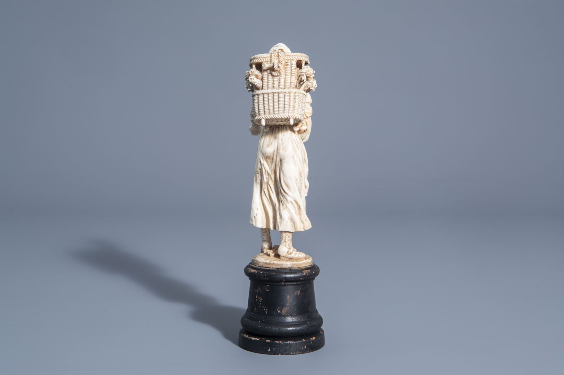 A carved ivory figure of a lady with poultry on wooden base, probably Dieppe, France, 19th C. - Image 4 of 7