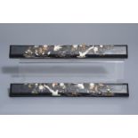 A pair of Chinese inlaid wooden wrist rests or scroll weights, 19th/20th C.