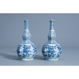 A pair of Chinese blue and white double gourd vases with floral design, Wanli