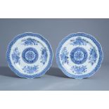 A pair of Chinese blue and white plates with scalloped rim and floral design, Qianlong